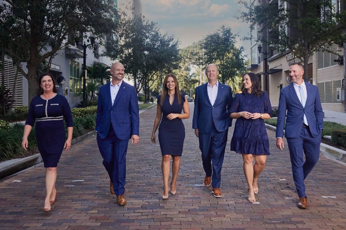 Corporate leadership team walking together during a business portrait session